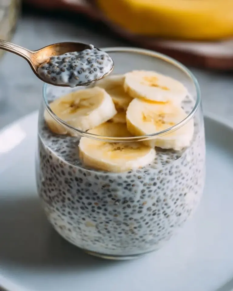 Healthy banana chia pudding with fresh bananas and chia seeds in a glass