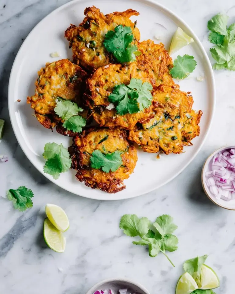 A plate of freshly made fish cutlets, golden brown and crispy, ready to serve.