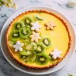 A delicious Kiwi Lime Curd Tart with vibrant green kiwi slices and creamy curd filling.