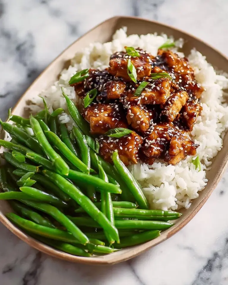 High protein sesame chicken dish with vibrant sesame seeds and vegetables