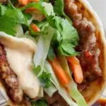 Delicious smash dumpling tacos with savory fillings and toppings.